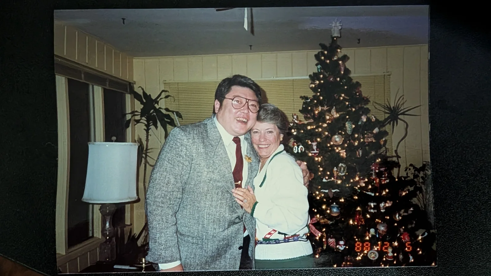 A family photograph of Art’s father beside a companion at Christmas.