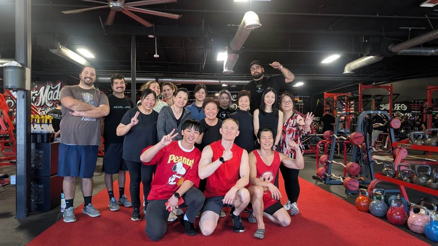 Art and members of his training community together in the gym.
