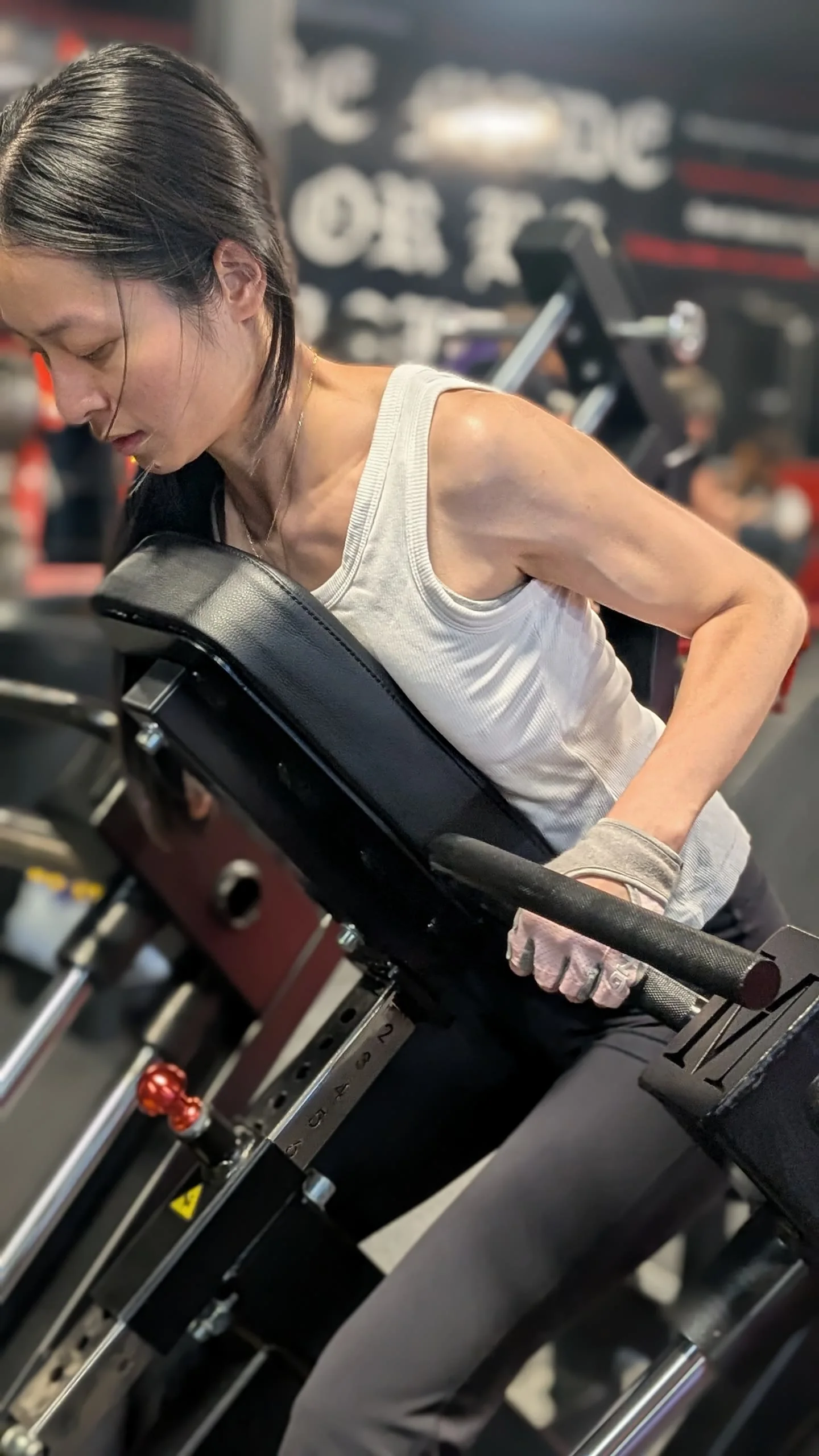 A woman performing a chest-supported row.